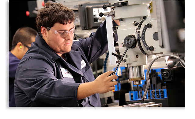 Student working on machine